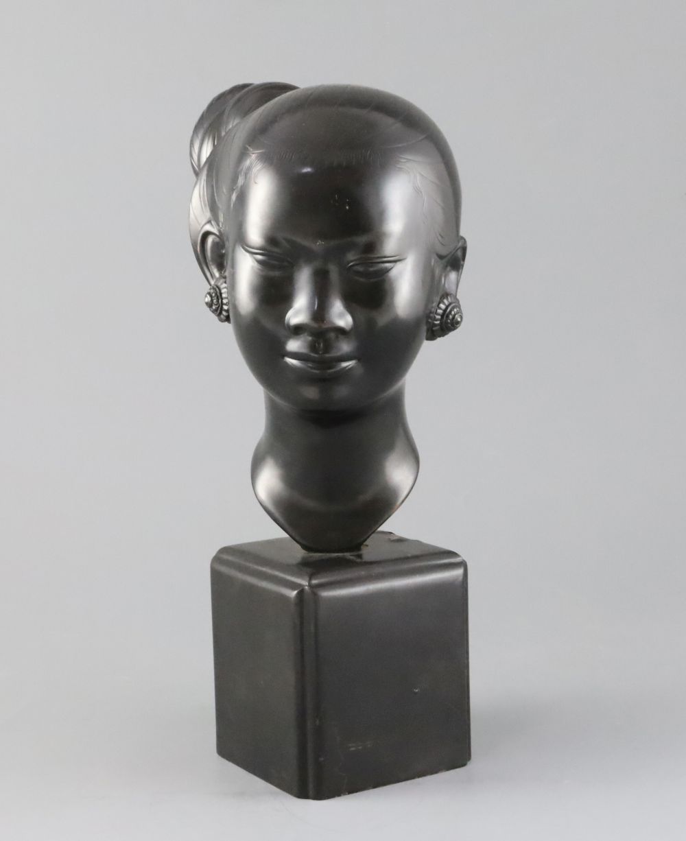 Nguyen Thanh Le (1919- Vietnam). A bronze head of a Vietnamese woman,